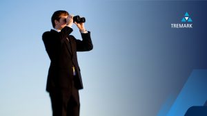 a private investigator with binoculars with a blue sky behind him
