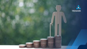 a cardboard cut-out of a pensioner on a stack of coins, implying retirement and pension age