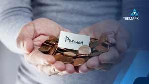somebody holding money for their pension, with the word 'pension' written on a piece of paper